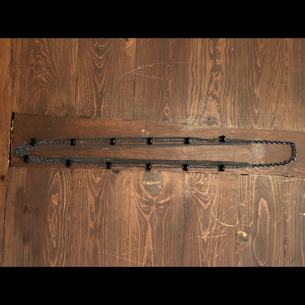 Long silver necklace with black beads